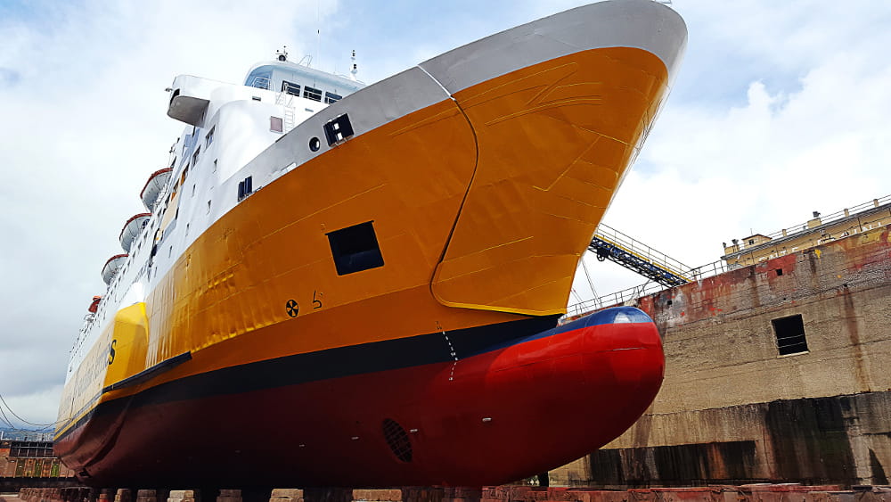 Yellow ship on a dry dock.